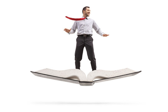 Businessman flying on a book