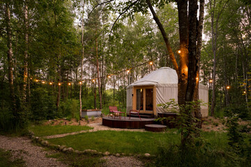 Beautiful yurt tent in forest