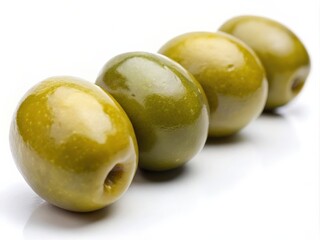 Close-up of fresh green olives on white background