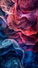 Colorful abstract image of flowing fabric-like shapes in red, pink, and blue hues, creating a soft and dynamic visual effect.
