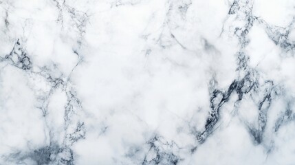 Fototapeta premium Elegant white marble texture with subtle gray veining, perfect for backgrounds and interior design aesthetics.