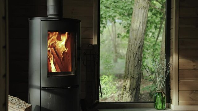 Immerse Yourself in the Cozy and Inviting Warmth of a Wood Stove Against a Stunning Nature View