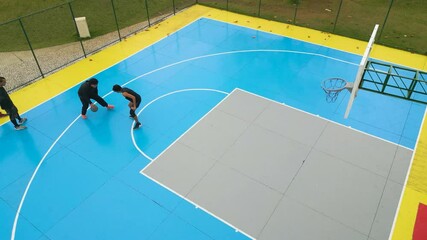 Group of friends playing basketball on outdoor court
- Powered by Adobe