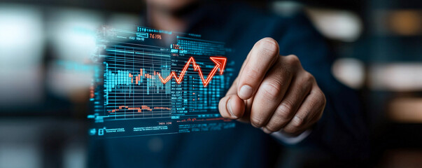 image depicts businessman interacting with digital financial graph, showcasing an upward trend. This visual representation emphasizes growth and success in business