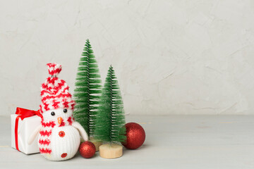 Small christmas trees with decoration on wooden table