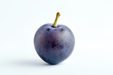 Obraz premium A close-up of a single dark grape with detailed texture, isolated on a clean white background.