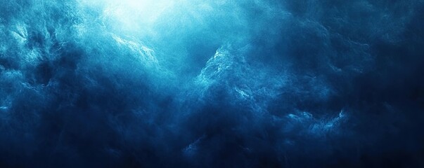 Obraz premium A dramatic blue ocean scene with textured waves and soft light, perfect for evoking emotion and tranquility.