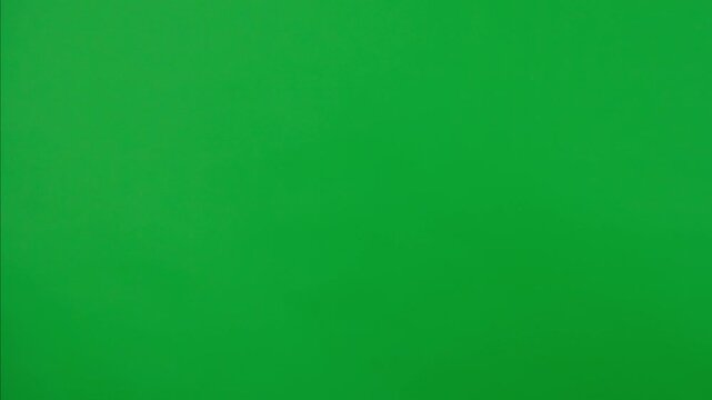 Creepy halloween monster hand in glitter slime and nails doing fist bump with female hand, isolated on chroma key green screen background, workspace mockup.