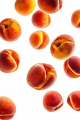 Close-up of multiple ripe peaches falling in mid-air, isolated on a clean white background.
