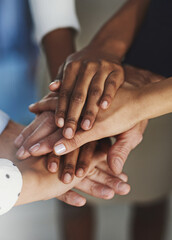 Business people, hands together or team with motivation for unity or collaboration at office. Closeup, diverse group or employees piling in solidarity for cooperation, support or mission at workplace