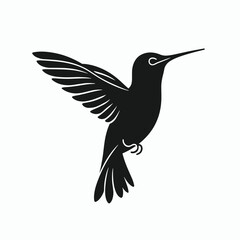 Fototapeta premium Silhouette of a hummingbird in flight with wings spread and beak pointed forward.