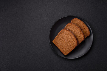 Fresh crispy brown bread sliced from whole grain flour
