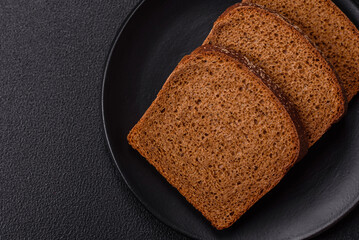 Fresh crispy brown bread sliced from whole grain flour