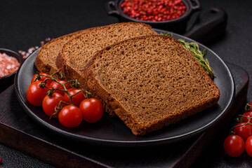 Fresh crispy brown bread sliced from whole grain flour