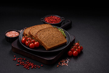 Fresh crispy brown bread sliced from whole grain flour