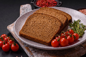 Fresh crispy brown bread sliced from whole grain flour