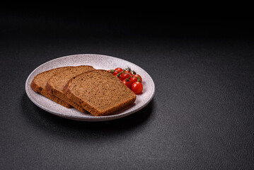 Fresh crispy brown bread sliced from whole grain flour