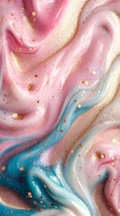 Close-up of glitter and pastel pink, blue, and gold liquid swirls layered on top of each other.