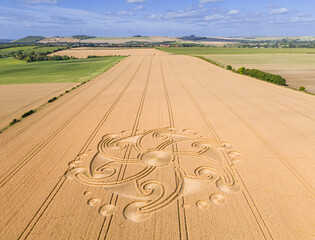 Aerial view of an intricate geometric crop circle formation in a wheat field near Etchilhampton and Devizes in Wiltshire, England, UK