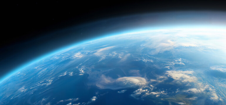 Realistic photo of Earth from space, showcasing the planet's blue atmosphere and cloud formations against the dark backdrop of space. Concept of planet Earth and space exploration