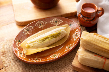 Tamales. hispanic dish typical of Mexico and some Latin American countries. Corn dough wrapped in...