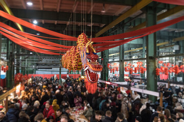 Chinese New Year. In the middle of the hall there is a symbol of a statue of a Chinese dragon