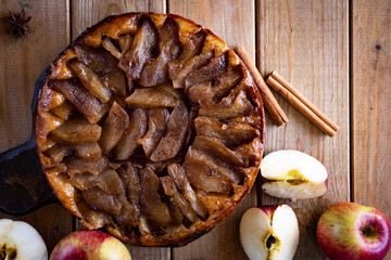 Apple tart on a wooden table. Apple pie for dessert. Close-up. View from above.