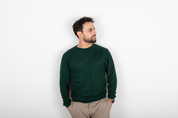 Fototapeta premium Portrait of a latin man looking to the side. White background