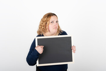 Naklejka premium Woman holding a black poster without text. Business template concept. White background