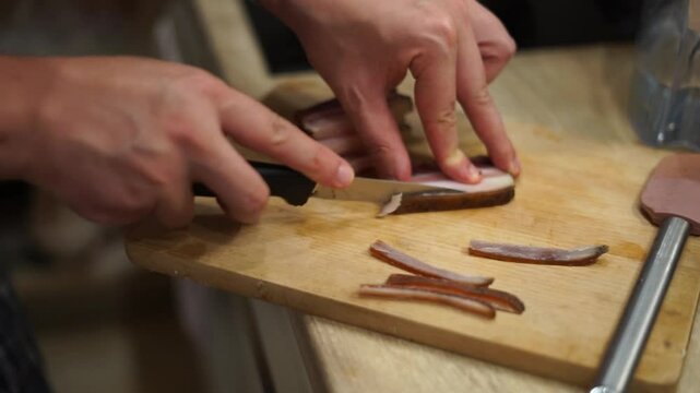 man cook husband cutting slicing bacon italian pancetta pasta carbonara homemade
