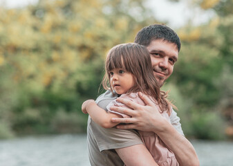 Fototapeta premium A father hugs his daughter