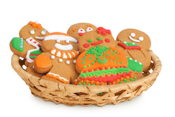 christmas gingerbread cookie in a wicker basket isolated on white background