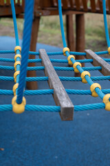 Plastic yellow rope clutch on the playground.
