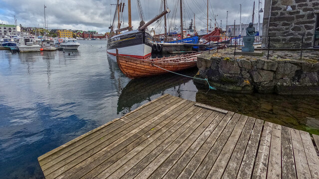 T&oacute;rshavn, Faroe Islands : July 21, 2024 Fiskikonan (Fish Woman) Statue on the edge of the harbor in T&oacute;rshavn, the Capital of the Faroe Islands. A knod to the fishing industry and it's history.