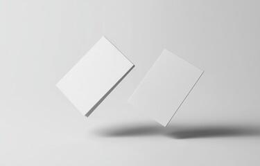Two Blank Business Cards Floating in the Air on a White Background, Mockup Style