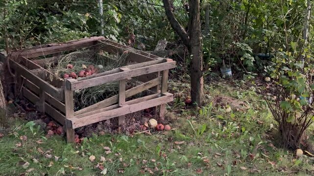 Wooden palette composter for kitchen and garden leftovers. Permaculture concept. Eco gardening