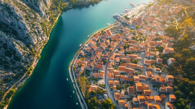 Aerial view of omis  stunning croatian coastal town with the winding cetina river in summer