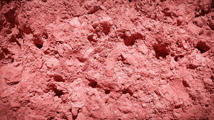 A textured backdrop in soft pink hues, resembling a natural stone surface. Ideal for design projects, banners, and creative backgrounds