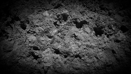 Monochromatic dark gradient with rough, stone-like texture in black and gray tones. Perfect for dramatic, high-contrast backgrounds