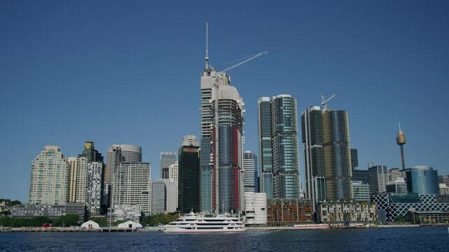 View of Sydney skyscrapers across body of water - steady cam