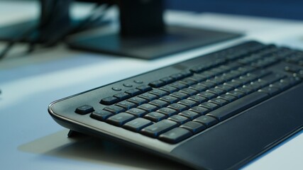 Extreme close up shot of computer displays on desk in server farm used for overseeing equipment....