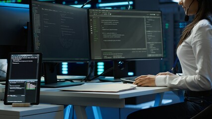 Technician in data center provides technical support to users, troubleshooting issues, close up....