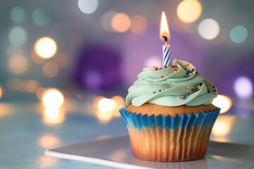 Delicious birthday cupcake with burning candle on turquoise background. Blurred lights create bokeh effect, space for text on festive dessert. Sweet treat for special occasion, celebration, holiday,