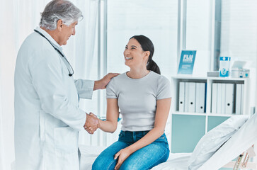 Smile, woman and handshake with doctor in hospital for greeting, introduction and meeting of...