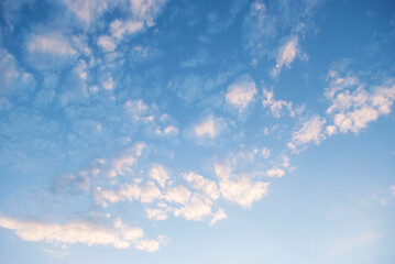 gentle white clouds in the blue sky