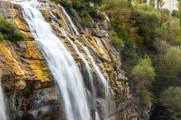 Long exposure of Tortum Waterfall cascading over rocks, symbolizing the passage of time and nature's force