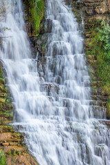 Long exposure of cascading Tortum Waterfall, symbolizing the persistence and flow of natural forces