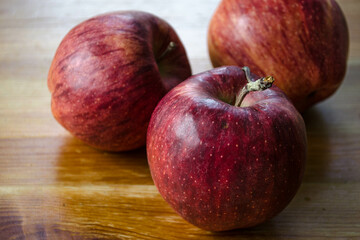 Three cameo apples on a table