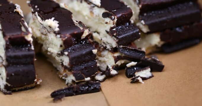 chocolate curd dessert with hazelnuts, close-up of a piece of cake with nuts and cottage cheese