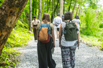 Tourists walk through Thailand's Death Railway, built using forced labor during World War II,...